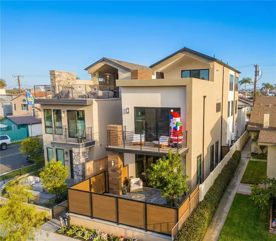 a front view of a house with outdoor seating