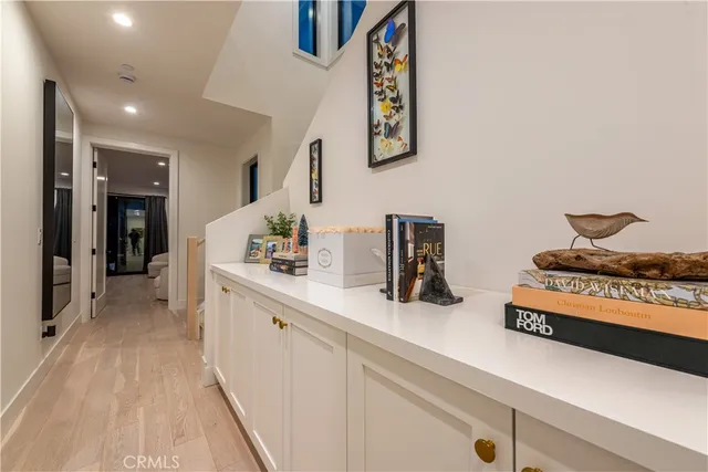 a spacious bathroom with a sink and a mirror