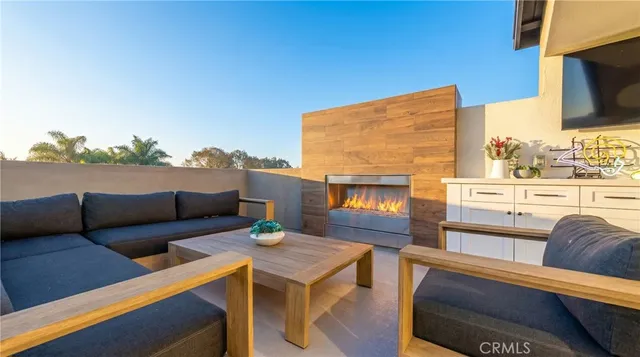 a outdoor living space with furniture and a fireplace