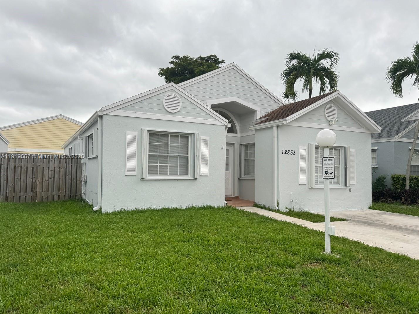 a view of an house with backyard space and garden