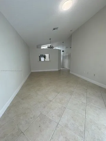 a view of room with a sink and mirror