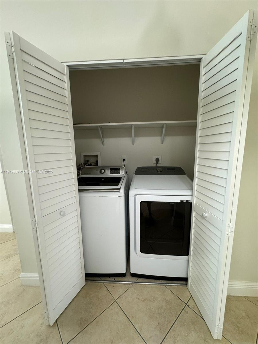 12833 Southwest 146th Terrace Miami, FL 33186 - Photo 17 of 29 a utility room with washing machine