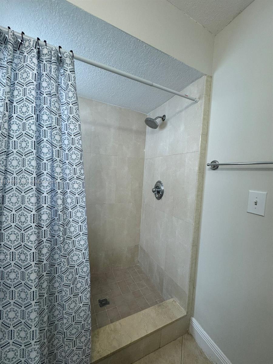 12833 Southwest 146th Terrace Miami, FL 33186 - Photo 19 of 29 a bathroom with a shower