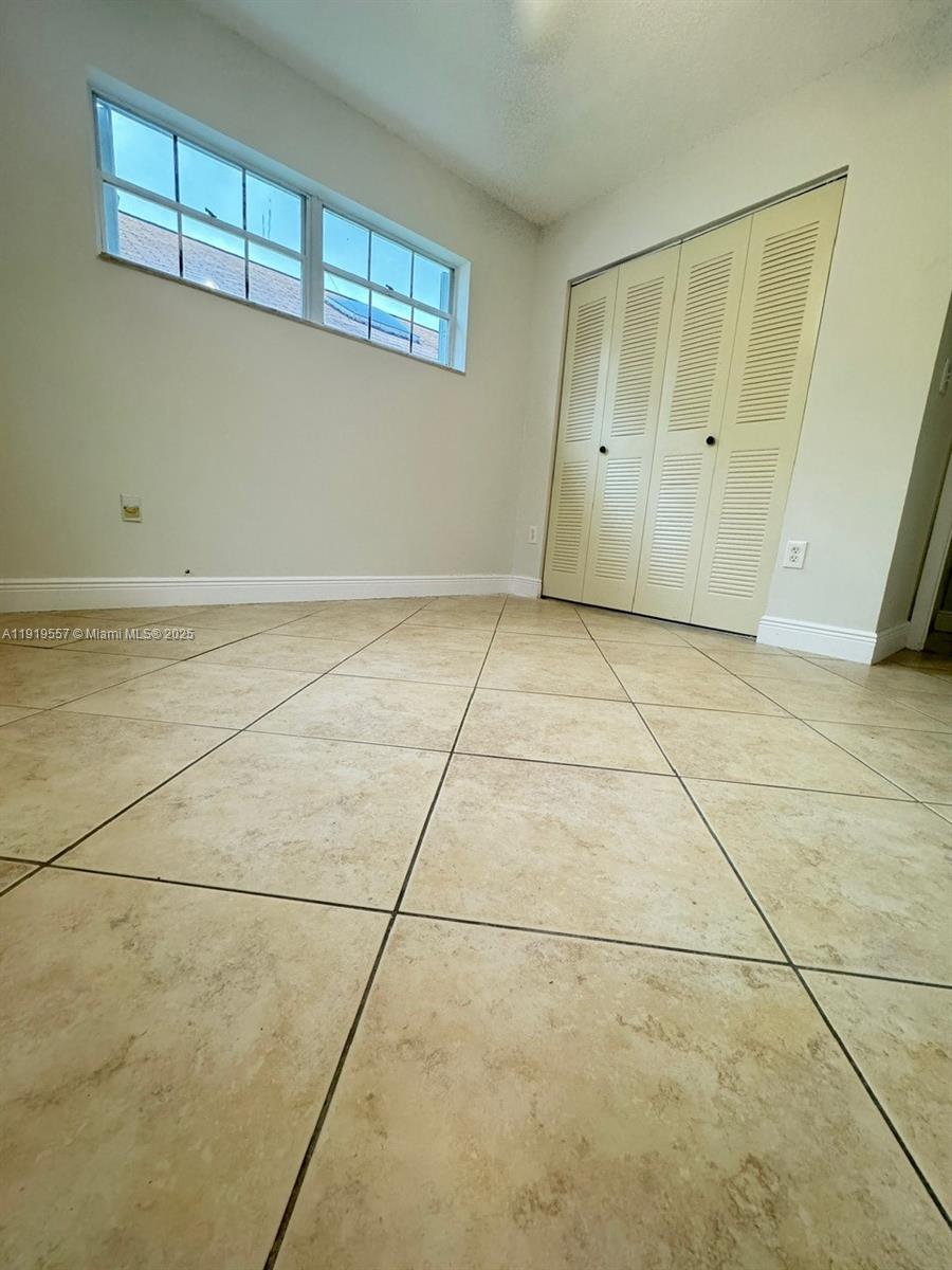 12833 Southwest 146th Terrace Miami, FL 33186 - Photo 21 of 29 a view of a room with an empty space