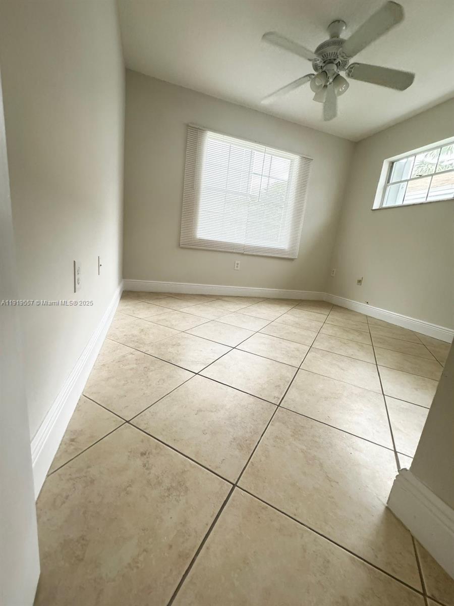 12833 Southwest 146th Terrace Miami, FL 33186 - Photo 22 of 29 a view of an empty room with a window
