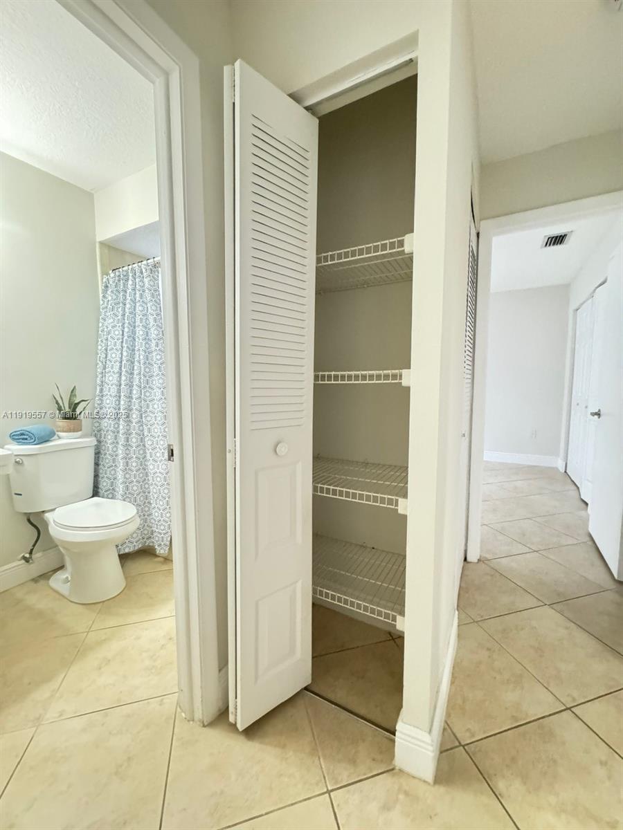 12833 Southwest 146th Terrace Miami, FL 33186 - Photo 23 of 29 a bathroom with a toilet and a shower