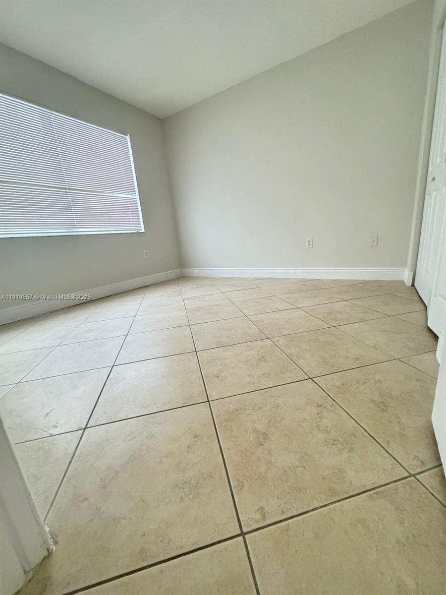 12833 Southwest 146th Terrace Miami, FL 33186 - Photo 24 of 29 a view of an empty room with a window