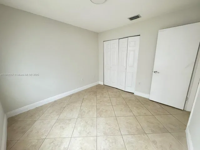a view of a kitchen with a sink and a chandelier