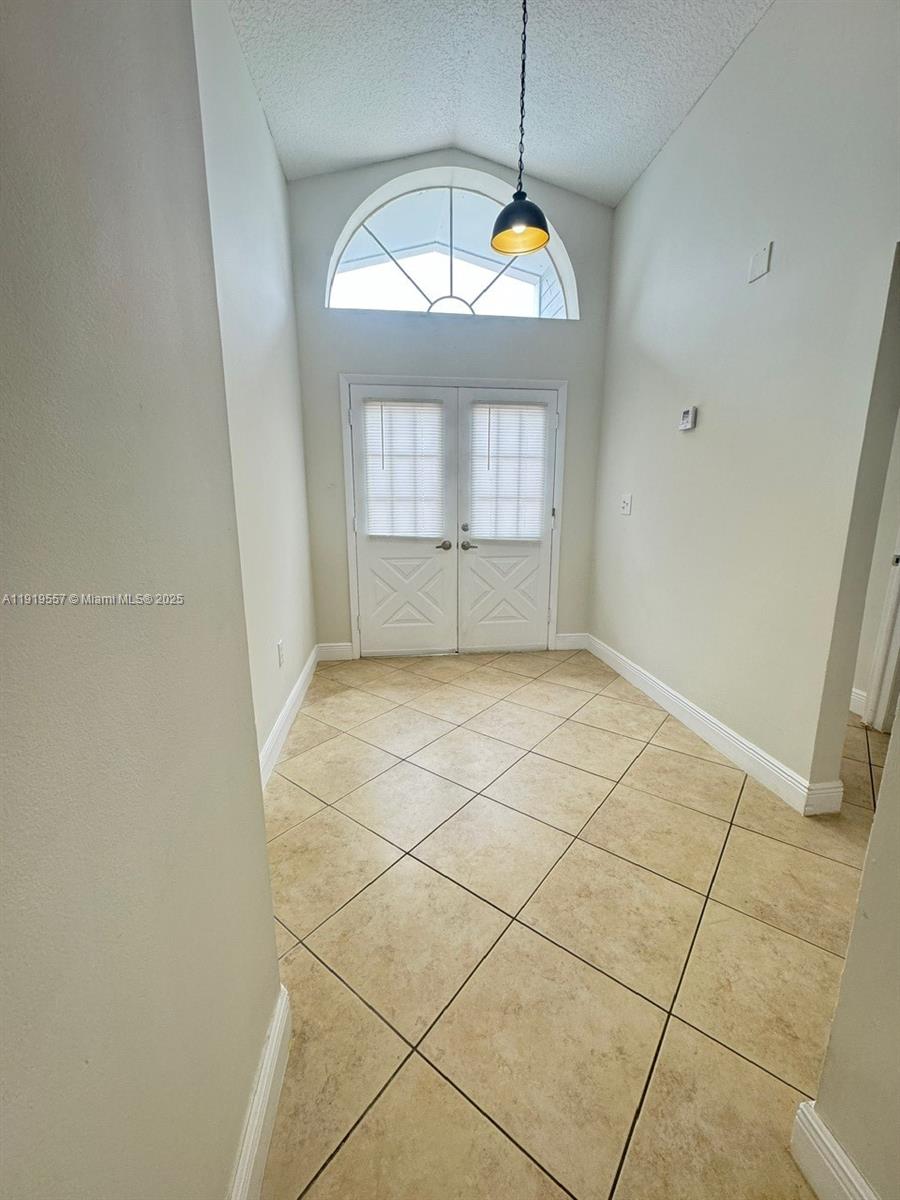 12833 Southwest 146th Terrace Miami, FL 33186 - Photo 7 of 29 a view of empty room with window