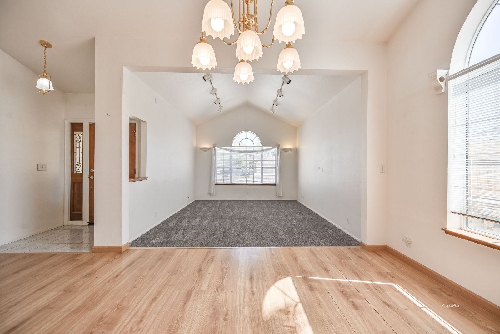 1209 West Robert Avenue Ridgecrest, CA 93555 - Photo 17 of 50 wooden floor in an empty room with a window