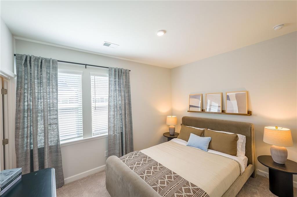 622 Shallowford Road, Unit ATHENS Gainesville, GA 30504 - Photo 25 of 31 a bedroom with a bed and a night stand