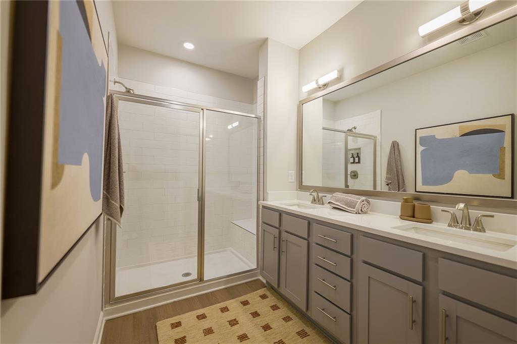 622 Shallowford Road, Unit ATHENS Gainesville, GA 30504 - Photo 28 of 31 a bathroom with a double vanity sink mirror and shower