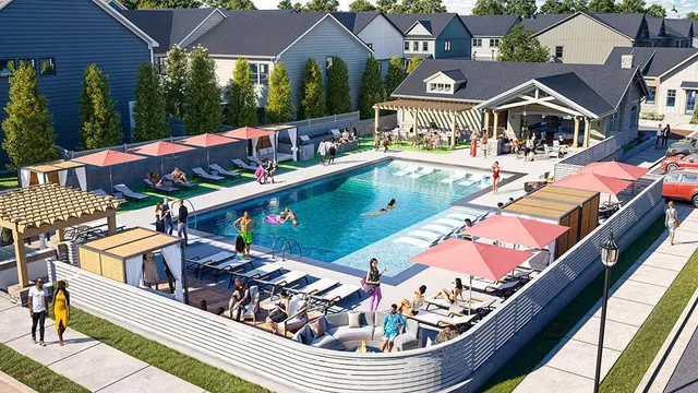 an aerial view of a house with swimming pool and outdoor seating