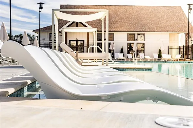 a view of a living room and kitchen