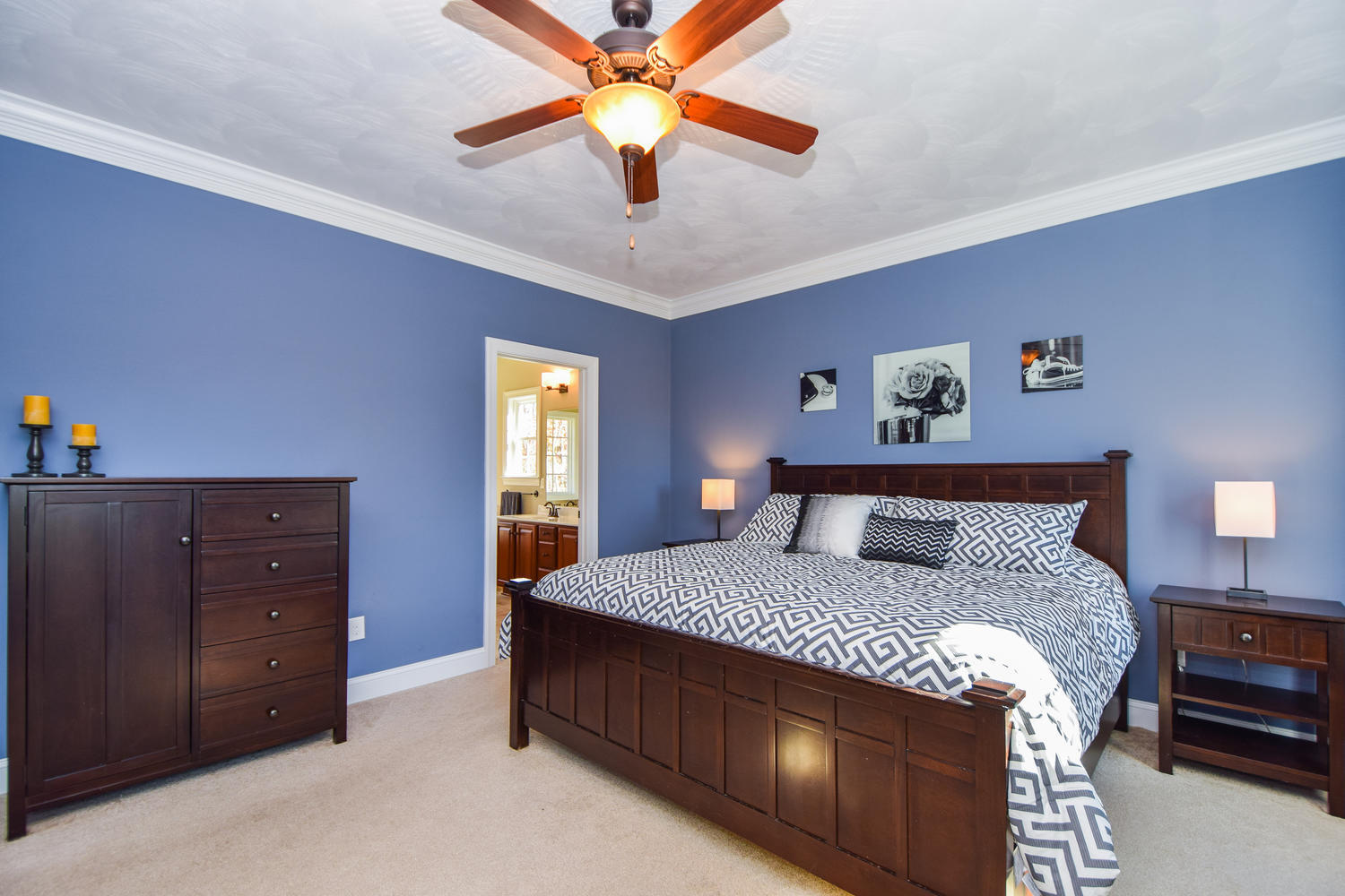 45 Turtle Rock Ridge Blue Ridge, VA 24064 - Photo 25 of 55 a bedroom with a bed and a chandelier