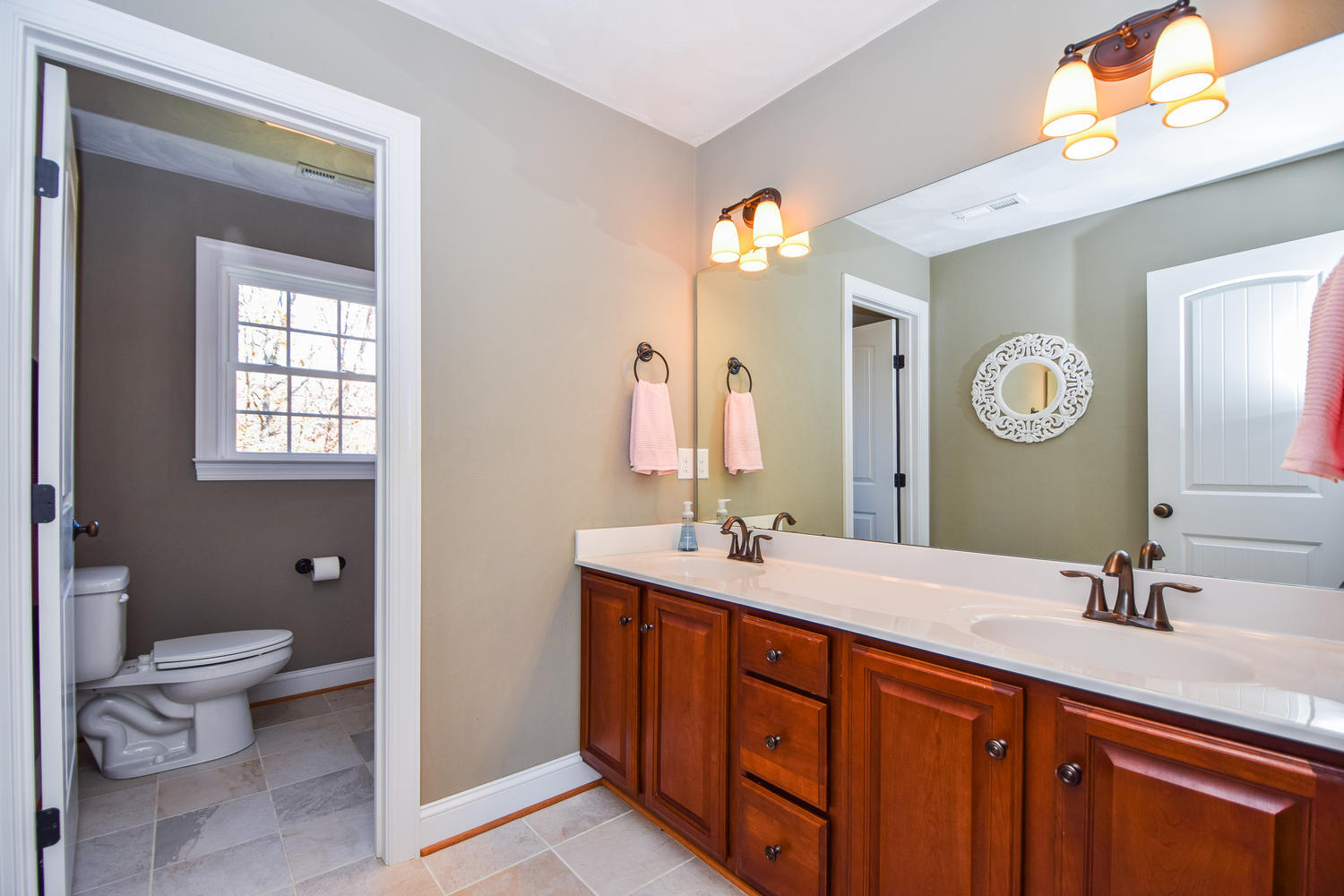 45 Turtle Rock Ridge Blue Ridge, VA 24064 - Photo 33 of 55 a spacious bathroom with a double vanity sink toilet and a mirror