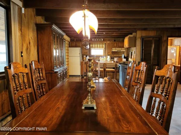 a room with wooden floor and furniture