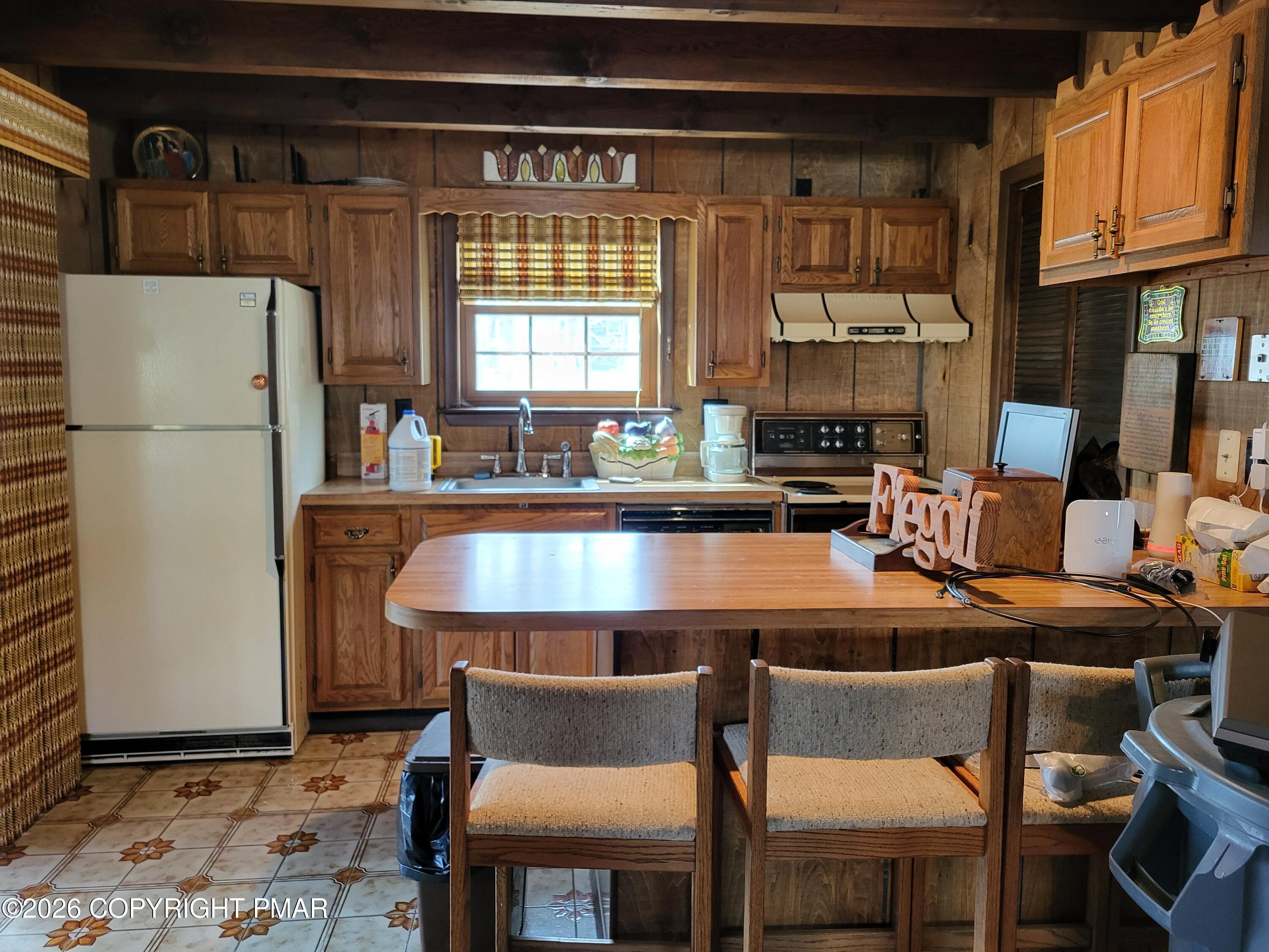 2014 Scarborough Way Bushkill, PA 18324 - Photo 30 of 82 a kitchen with stainless steel appliances a table and chairs