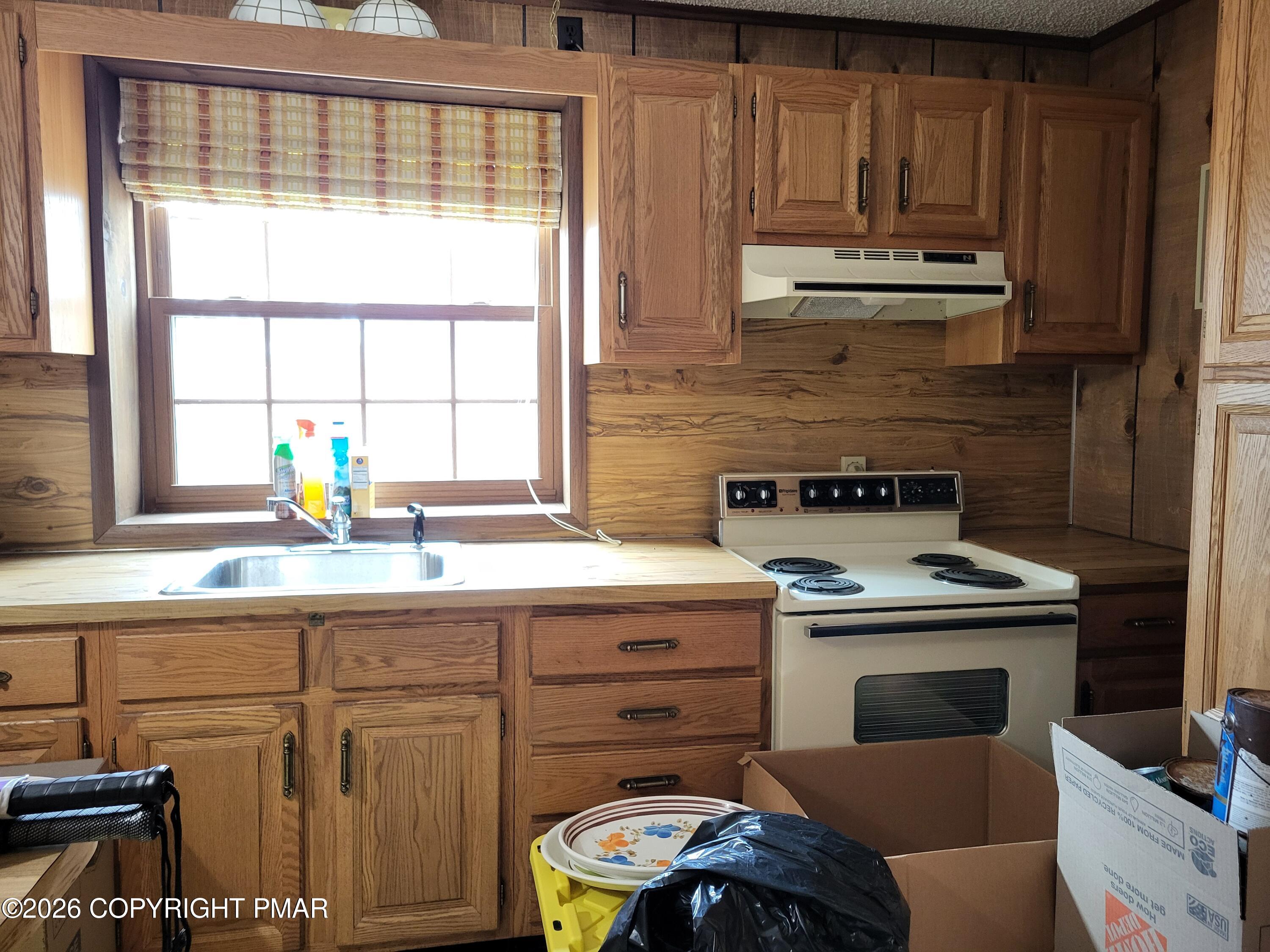 2014 Scarborough Way Bushkill, PA 18324 - Photo 45 of 82 a kitchen with a stove a sink and cabinets