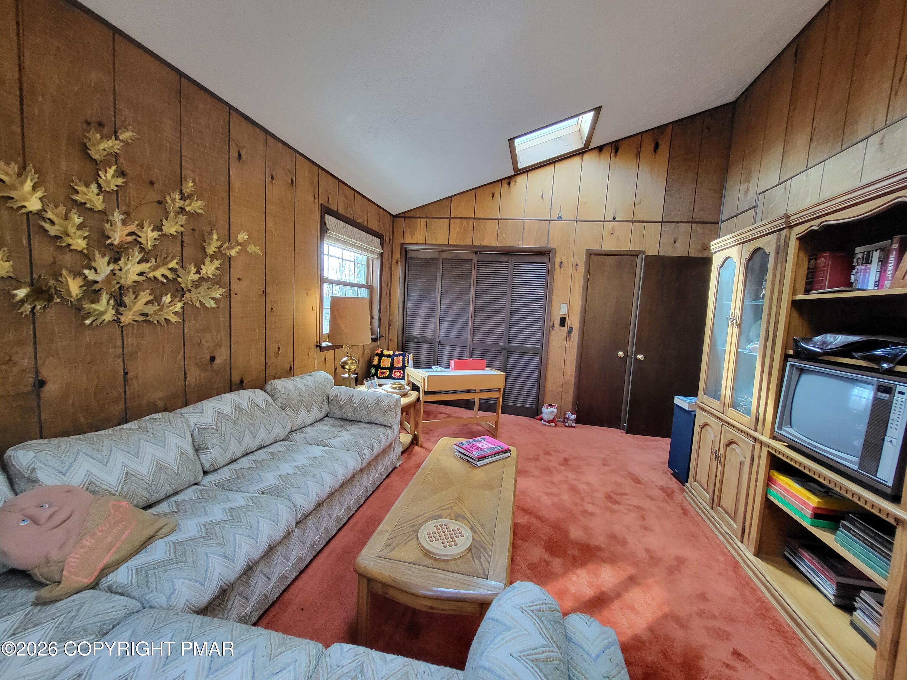 2014 Scarborough Way Bushkill, PA 18324 - Photo 6 of 82 a living room with furniture and a bookshelf