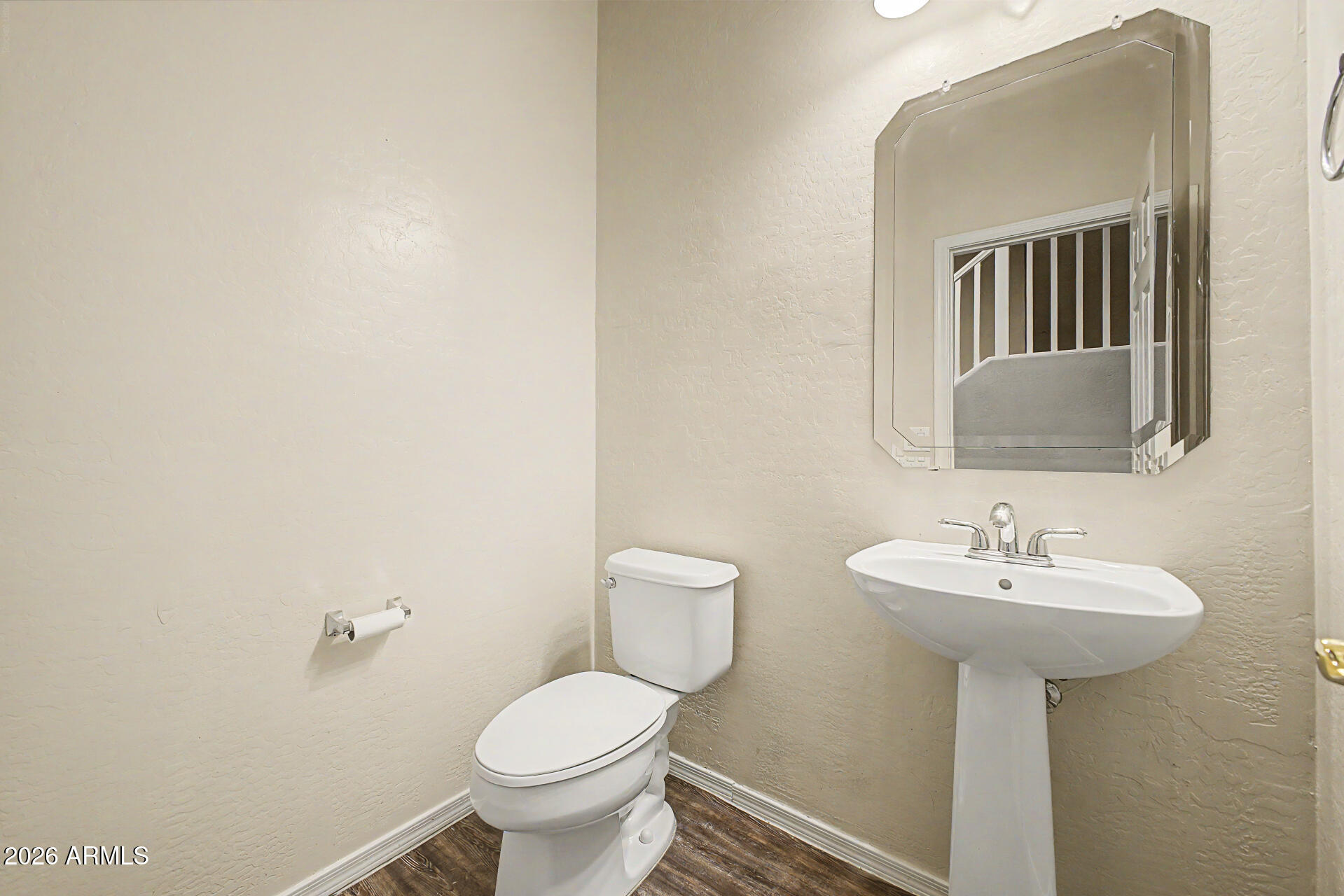 6622 West Harwell Road Laveen, AZ 85339 - Photo 13 of 32 a bathroom with a sink toilet and a mirror