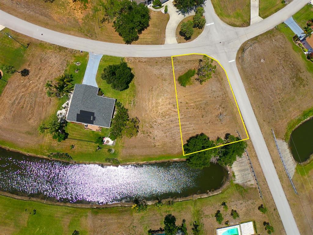 133 Fairway Road Rotonda West, FL 33947 - Photo 3 of 16 an aerial view of a house with a swimming pool