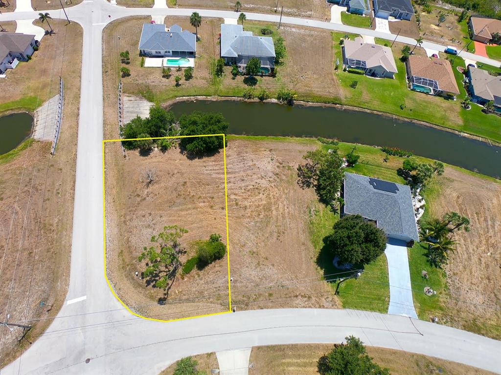 133 Fairway Road Rotonda West, FL 33947 - Photo 7 of 16 an aerial view of a house with a yard