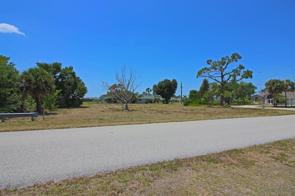 133 Fairway Road Rotonda West, FL 33947 - Photo 10 of 16 a view of a yard with a house