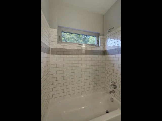 a bathroom with a sink toilet and mirror