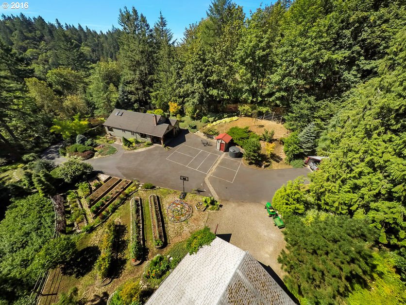 14715 Northwest Newberry Road Portland, OR 97231 - Photo 29 of 32 an aerial view of a house with a yard swimming pool and lake view
