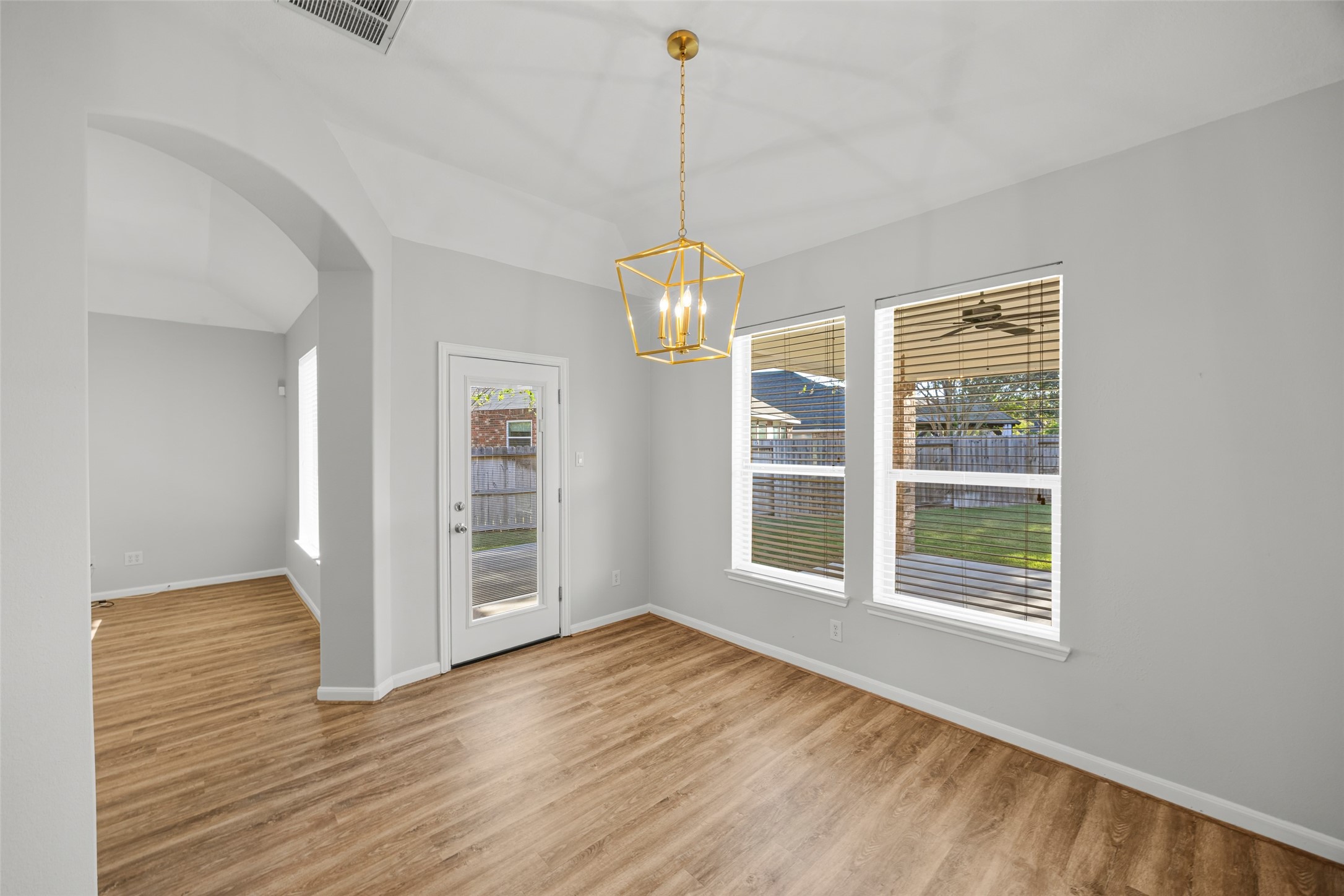 12322 West Elizabeth Shore Loop Cypress, TX 77433 - Photo 11 of 28 a view of an empty room with wooden floor and a window