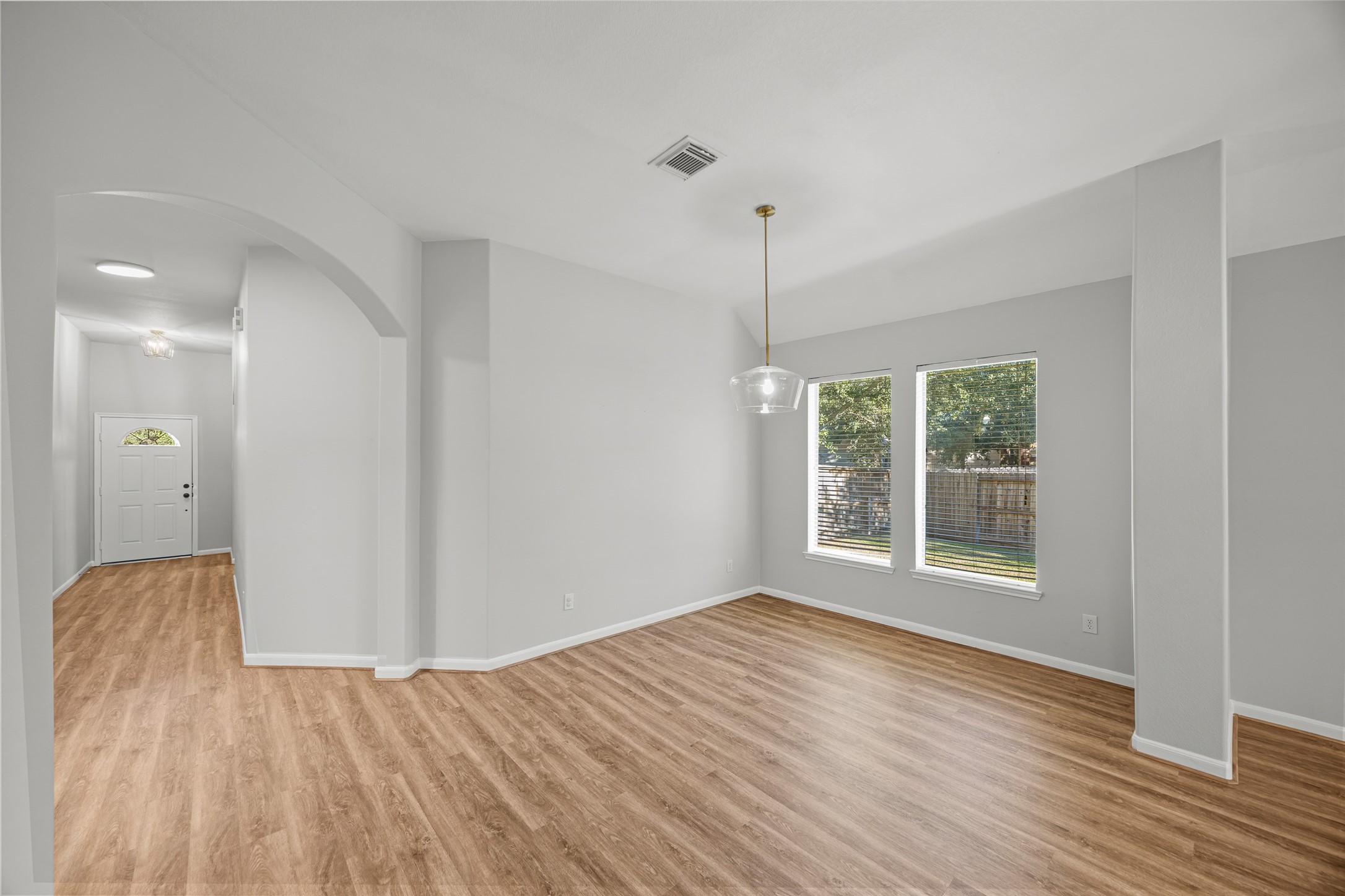 12322 West Elizabeth Shore Loop Cypress, TX 77433 - Photo 7 of 28 a view of an empty room with wooden floor and a window