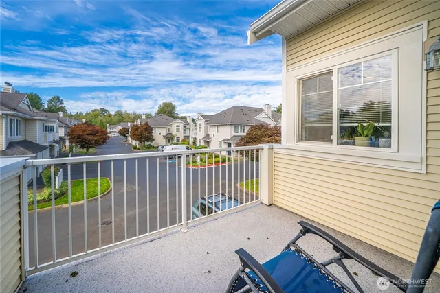a view of a balcony with furniture