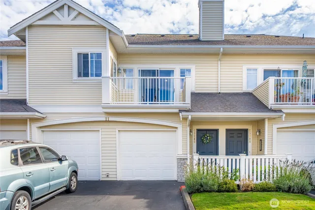 a car parked in front of a brick house