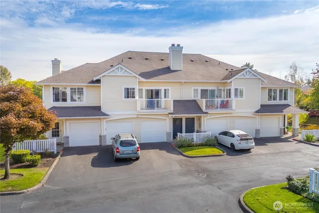 an aerial view of residential house with yard and swimming pool