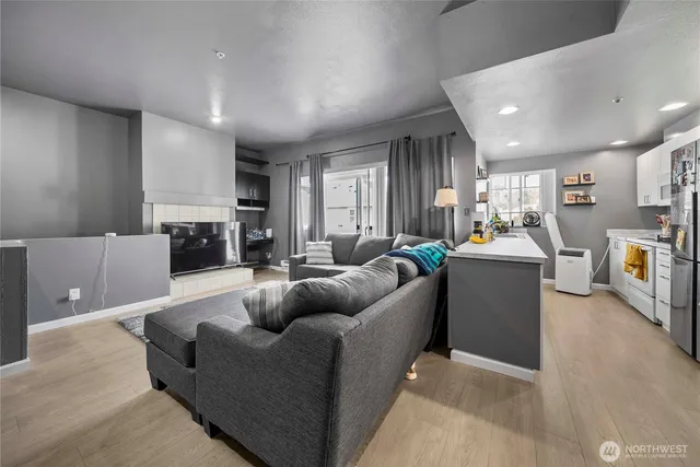 a living room with furniture and a flat screen tv