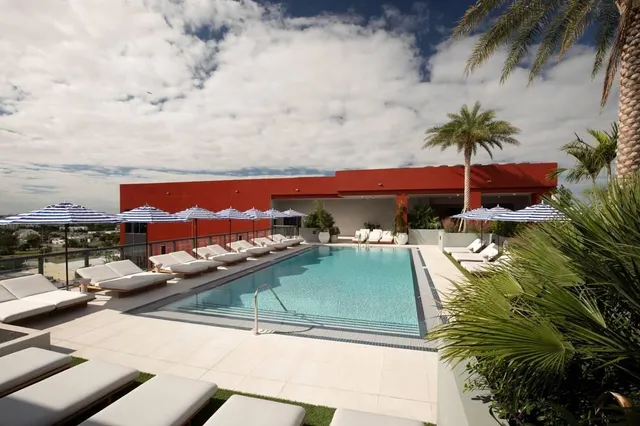 a view of swimming pool with a table and chairs