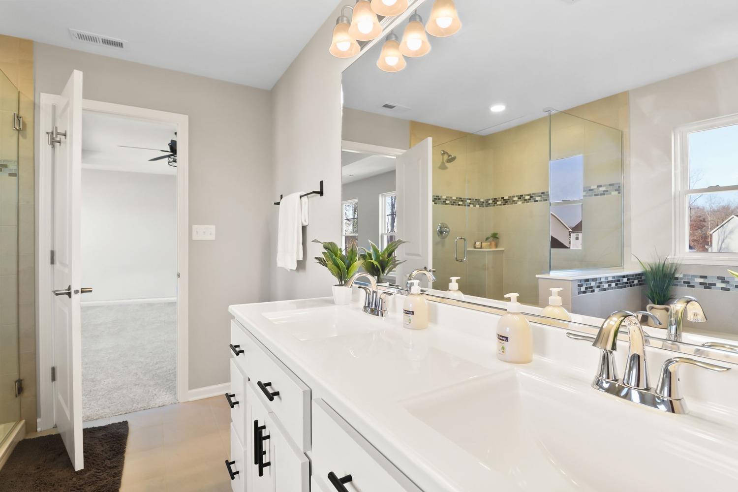 2592 Ritter Street Chesterton, IN 46304 - Photo 19 of 25 a bathroom with a double vanity sink mirror and