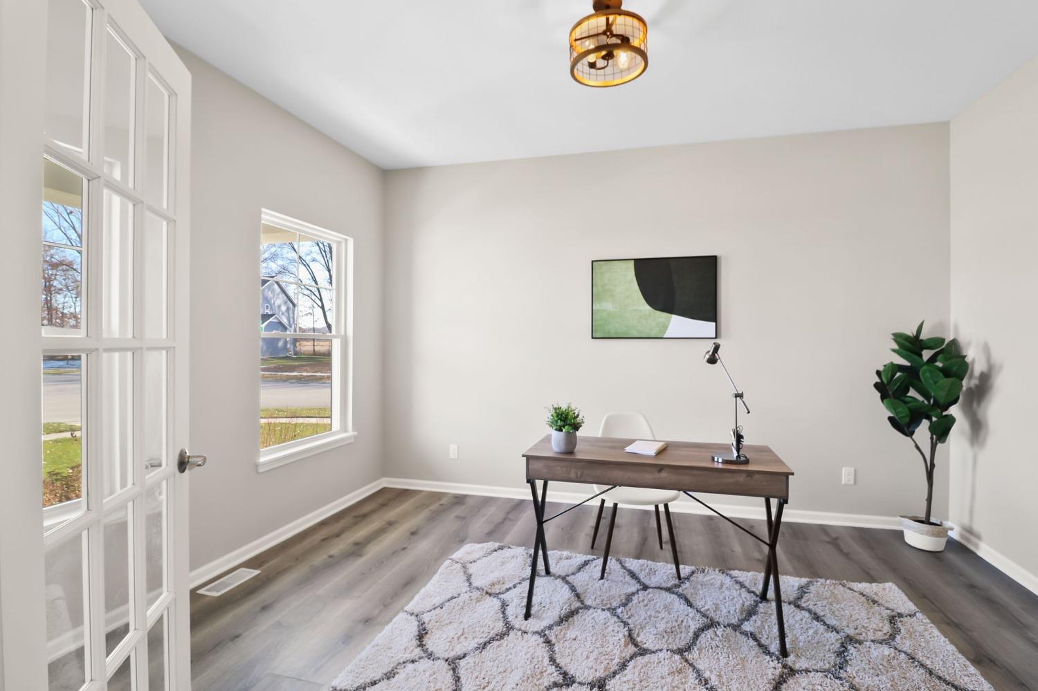 2592 Ritter Street Chesterton, IN 46304 - Photo 5 of 25 a view of a livingroom with furniture and a potted plant