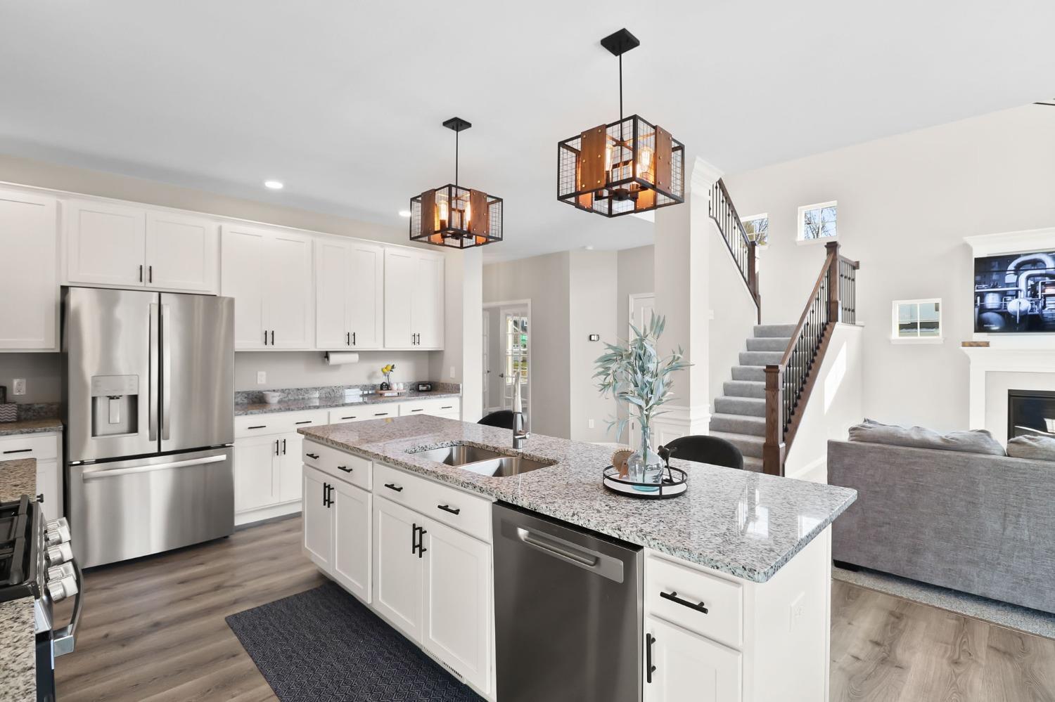 2592 Ritter Street Chesterton, IN 46304 - Photo 6 of 25 a kitchen with stainless steel appliances granite countertop a sink a stove and refrigerator