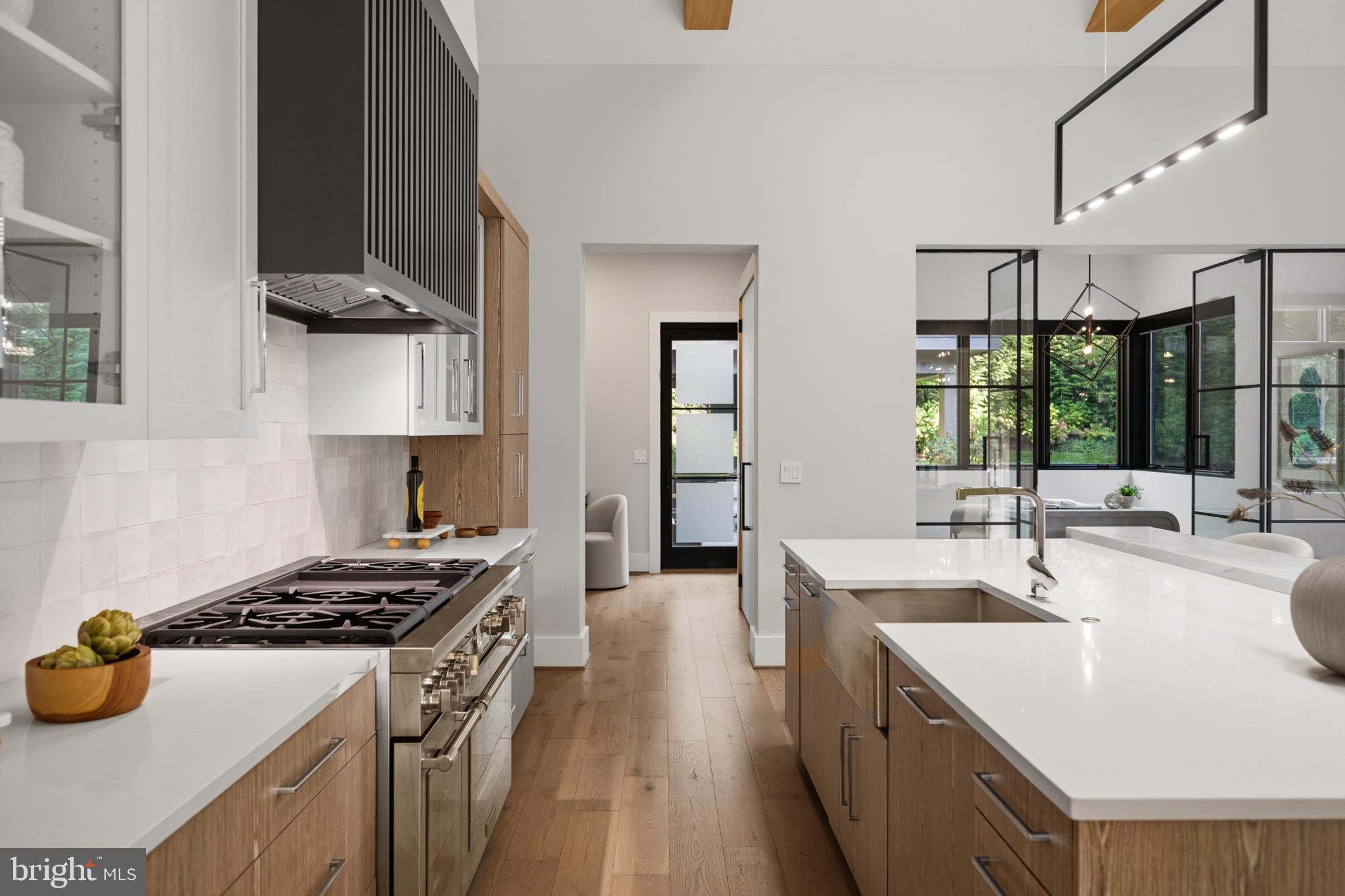 1137 Basil Road McLean, VA 22101 - Photo 42 of 118 gas range framed by sleek black hood