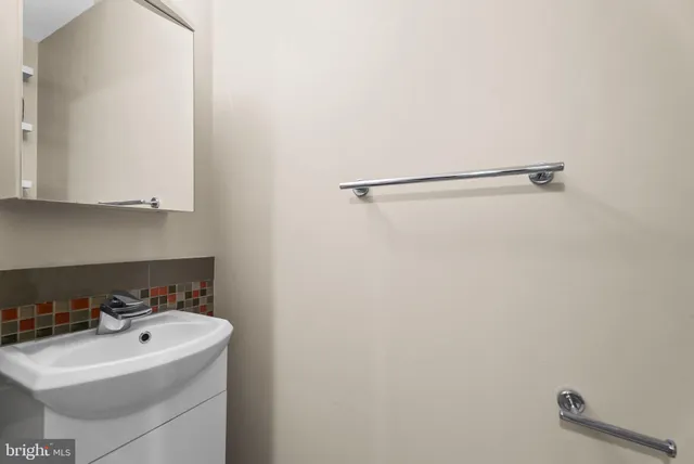a view of a balcony with wooden floor and fence