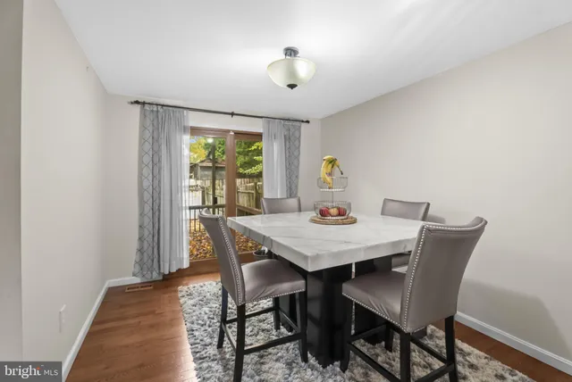 a kitchen with stainless steel appliances granite countertop a sink stove and microwave