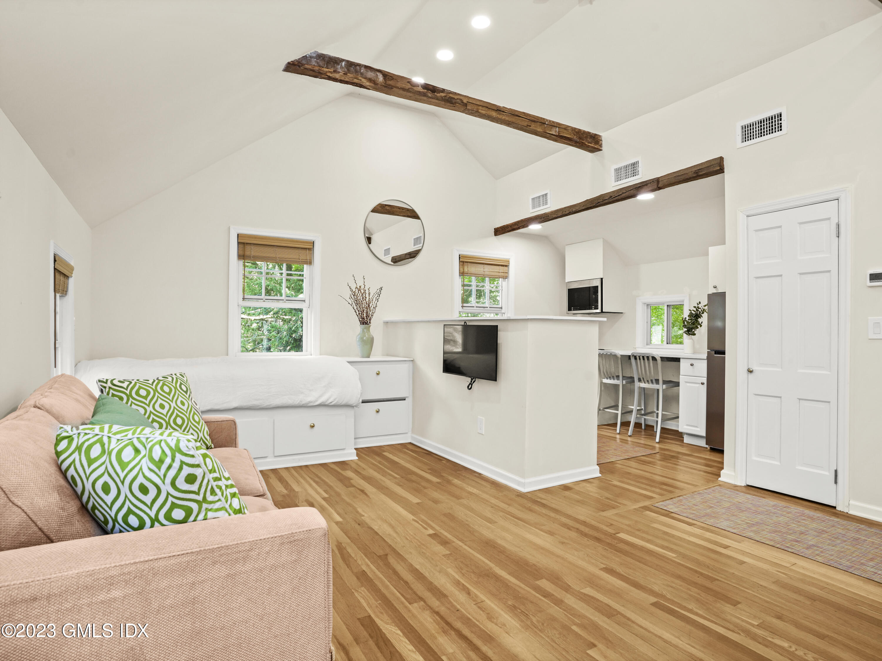 470 June Road, Unit STUDIO Stamford, CT 06903 - Photo 3 of 11 a living room with a couch and a table