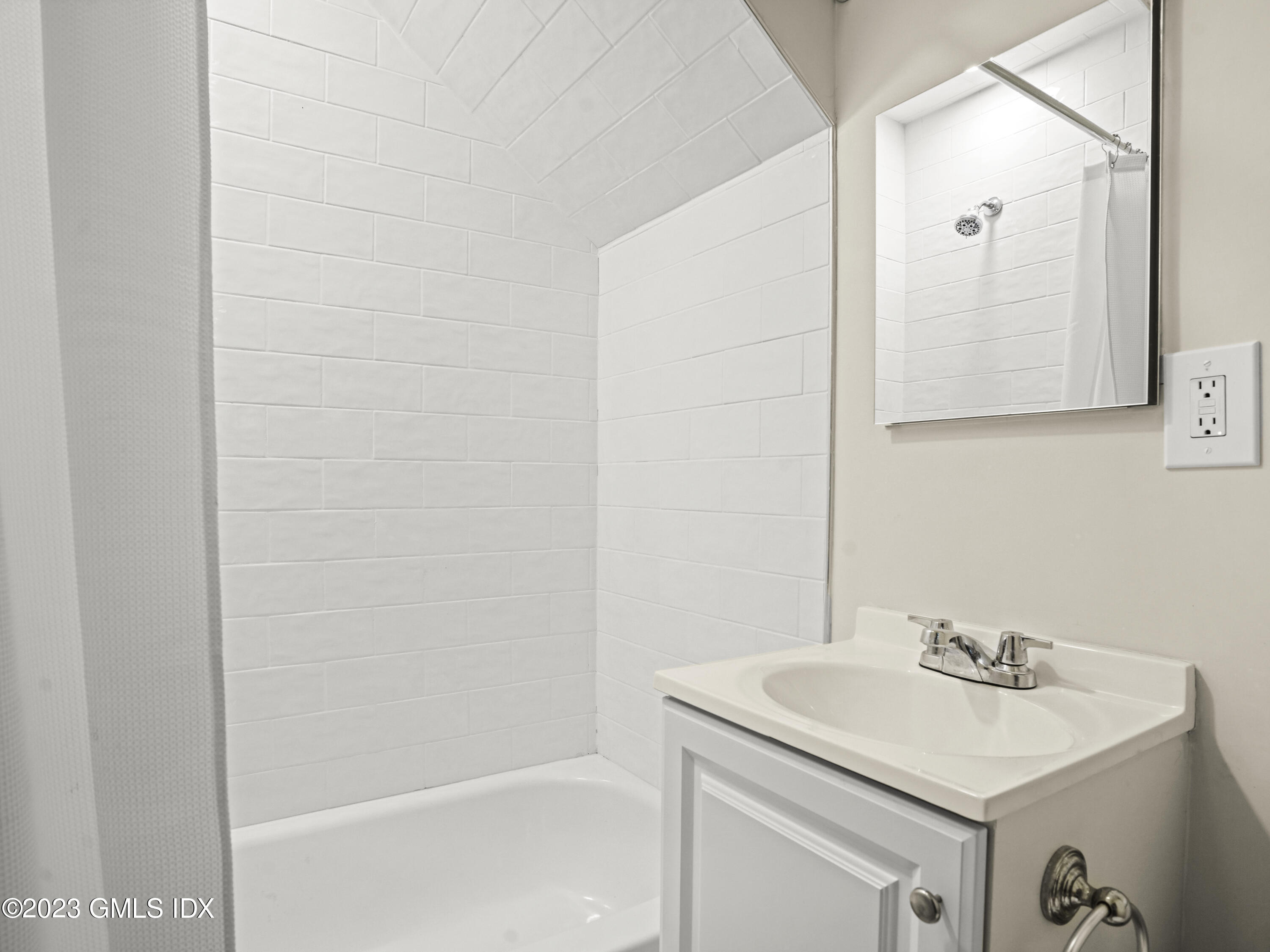 470 June Road, Unit STUDIO Stamford, CT 06903 - Photo 6 of 11 a bathroom with a sink and a mirror