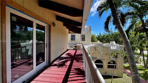 a view of a door and chair in the balcony