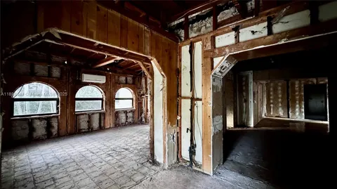 a view of a house with large windows