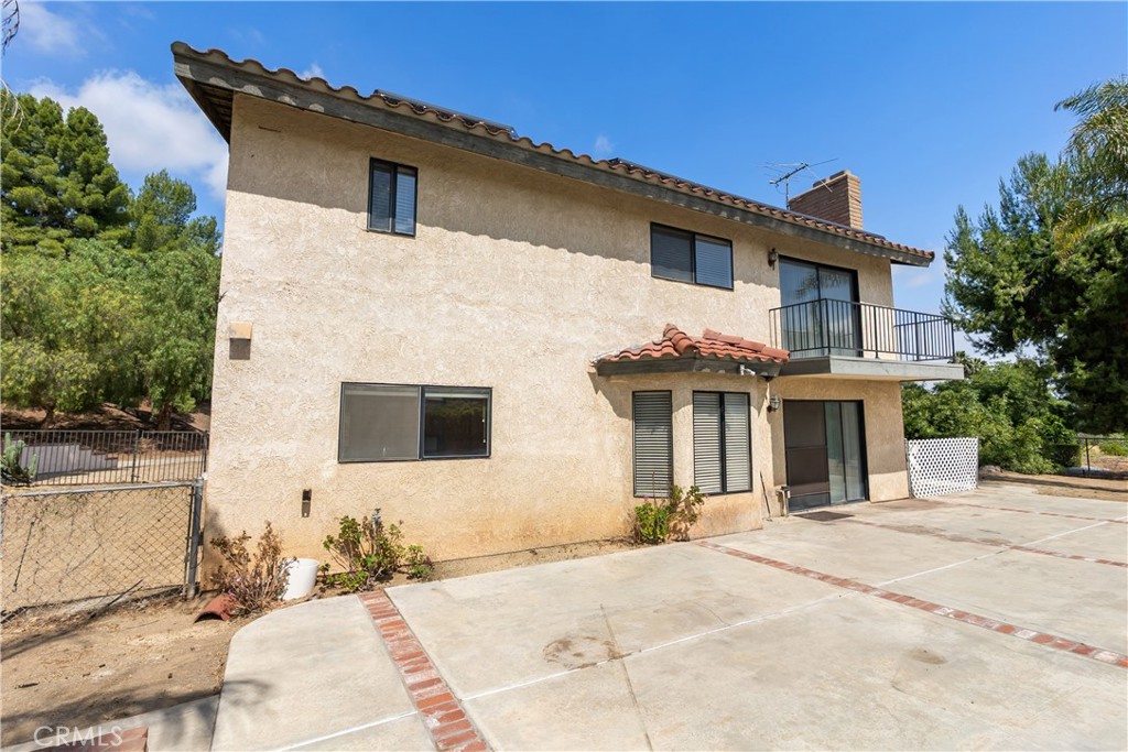 17656 Mockingbird Hill Circle Riverside, CA 92504 - Photo 31 of 49 a front view of a house with a yard