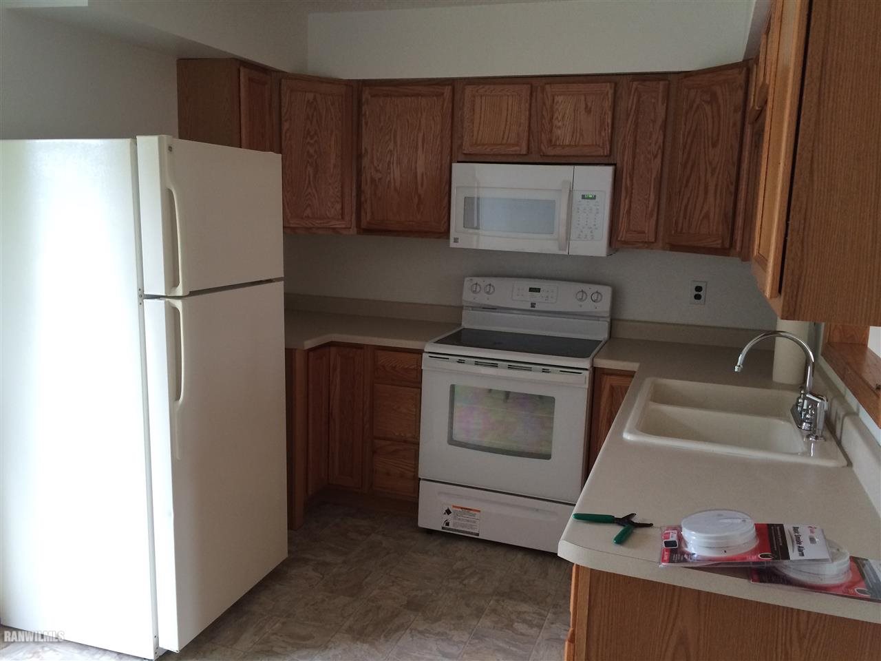 4086 Il Route Thomson, IL 61285 - Photo 8 of 12 a kitchen with a refrigerator sink and cabinets