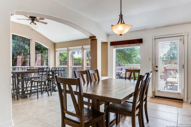 a view of a dining room with furniture window and outside view
